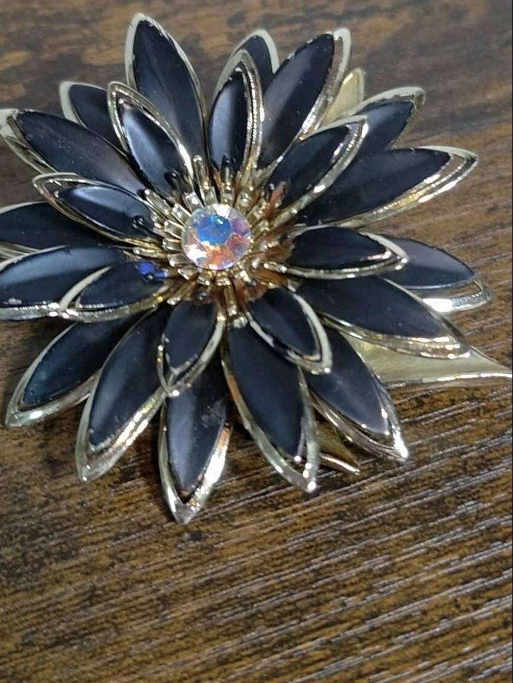 Gold-Tone Black Flower Brooch with Aurora Crystal Center